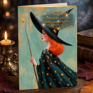 May include: A greeting card featuring an illustration of a person with bright orange hair wearing a dark green cloak with gold stars and a wide-brimmed hat. The text reads: A little sparkle, a little brew... Wishing a magical night to you.