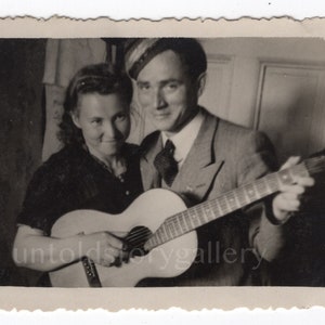 Musician couple playing guitar, Found snapshot