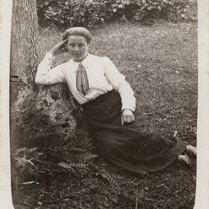 Girl laying on the grass, Vintage photo