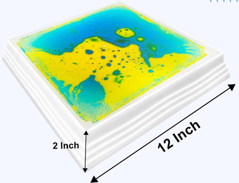 Może przedstawiać: Kwadratowa zabawka sensoryczna z białą ramą i niebieskim i ż&oacute;łtym płynem w środku. Zabawka ma wymiary 30,5 cm x 30,5 cm i grubość 5 cm.