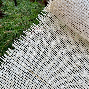 May include: White woven fiberglass mesh fabric, often used for chair seats and upholstery.