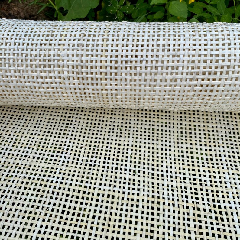 May include: A roll of white cane webbing, a woven material used for upholstery and furniture making.