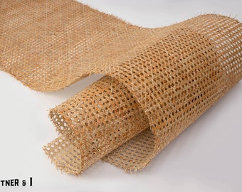 May include: A roll of natural cane webbing, a woven material used for chair seats and other furniture upholstery.
