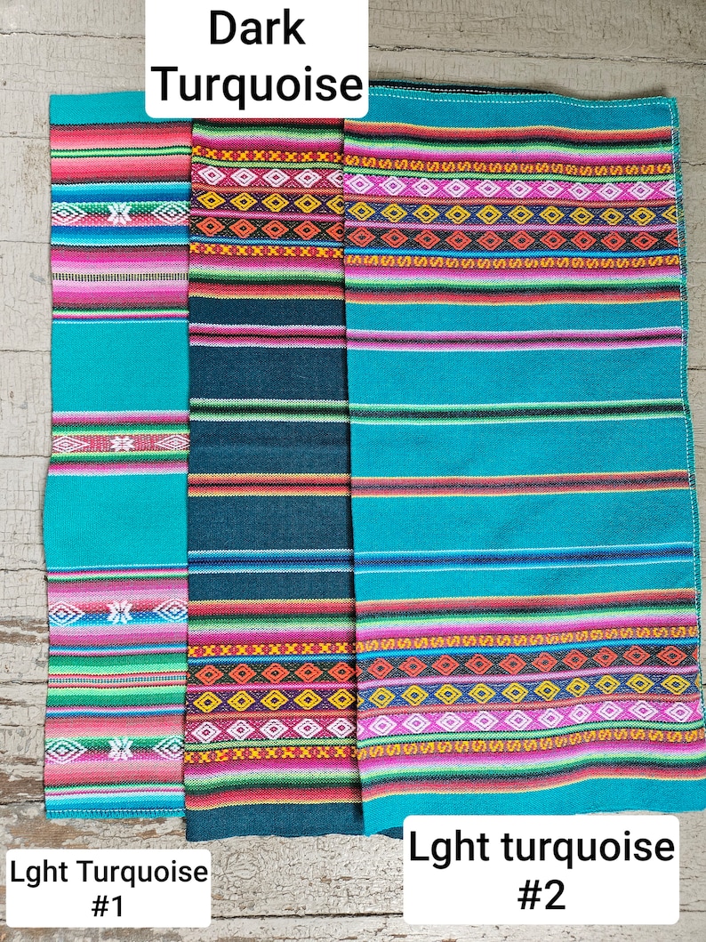 May include: Three woven fabric samples with colorful stripes and geometric patterns. The fabric on the left is a light turquoise color, the middle fabric is a dark turquoise color, and the fabric on the right is a light turquoise color. The fabric samples are labeled "Lght Turquoise #1", "Dark Turquoise", and "Lght turquoise #2".