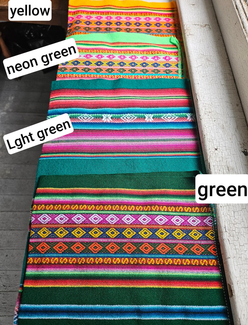 May include: Four colorful woven fabric strips with different patterns. The top strip is yellow, the second is neon green, the third is light green, and the bottom strip is green.