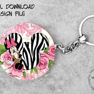 May include: A pink and black zebra print Minnie Mouse keychain with pink roses and a white background. The keychain has a silver metal ring.