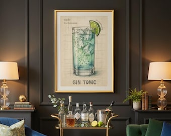 May include: A framed "Gin Tonic" print hangs above a gold bar cart. The cart holds bottles of liquor, a cocktail shaker, and glasses. A blue armchair and green sofa flank the cart. Two lamps with glass bases sit on either side of the print.