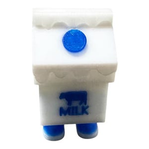 Lindo llavero con clicker de cartón de leche: juguete antiestrés impreso en 3D con interruptor mecánico. Divertido regalo kawaii para escritorio, gamers y coleccionistas.