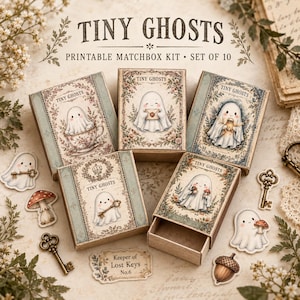 May include: A printable matchbox kit titled Tiny Ghosts featuring ten boxes with illustrations of ghosts, floral borders, and vintage motifs. The set includes paper cutouts of ghosts, mushrooms, acorns, and keys on a light, textured background.