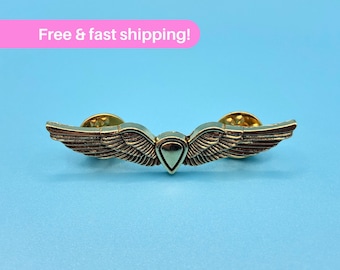 Ellie&#39;s Shield Wings Enamel Pin from The Last of Us - Unique Accessory for Gamers & Show Lovers