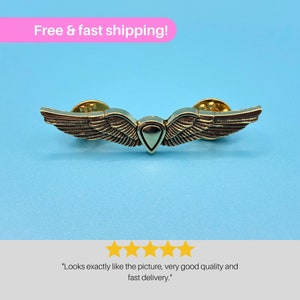 Ellie's Shield Wings Enamel Pin from The Last of Us - Unique Accessory for Gamers & Show Lovers