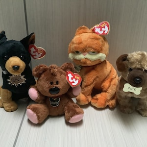 ty “ Luca~ Pooky ~ Garfield ~ Odie “ beanie baby