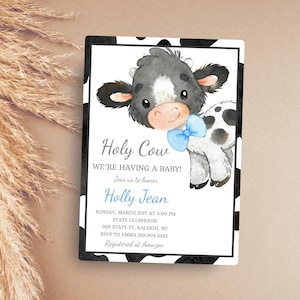 Puede incluir: Una invitación a una fiesta de bienvenida al bebé con una ilustración de una vaca en blanco y negro que lleva una pajarita azul. El texto dice "Holy Cow We're Having a Baby! Join us to honor Holly Jean Sunday, March 21st at 3:00 PM State Clubhouse 305 State St, Raleigh, NC RSVP to Emma 919.904.5432 Registered at Amazon"