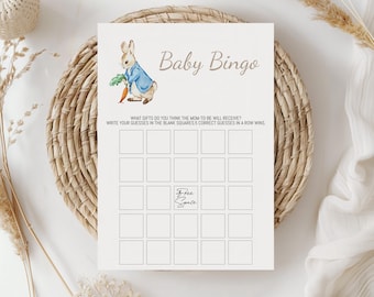 May include: A printable baby bingo card with a cartoon rabbit holding a carrot. The card has a grid of squares with the text "Free Space" in the center square. The text "Baby Bingo" is at the top of the card. The text "What gifts do you think the mom-to-be will receive? Write your guesses in the blank squares. 5 correct guesses in a row wins." is below the grid.