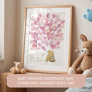 Puede incluir: Letrero de libro de visitas para baby shower enmarcado, con globos rosas en forma de corazón con nombres, una ilustración de Winnie the Pooh y el texto "You are so loved". Se ve un oso de peluche y un conejito de peluche.
