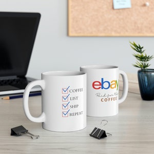 May include: Two white ceramic mugs with a humorous design. One mug features a checklist with the words "Coffee, List, Ship, Repeat". The other mug has the eBay logo and the text "Paid for this Coffee".