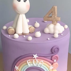 Unicorn themed fondant covered cake