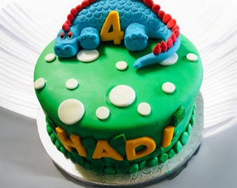 dinosaur fondant covered birthday cake