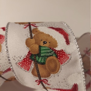 5 yds Wired Ribbon, Teddy Bear in Santa Cap on a white background, with a Glitter and silver edge Active