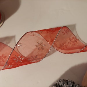5 yds Wired Ribbon, Sliver Glitter Snow flake pattern on a Sheer Red background, with a Silver edge