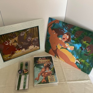 Disney&#39;s Sealed Tarzan VHS, Collectible Watches, and Lithograph