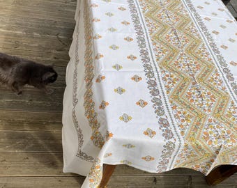 A rectangular vintage tablecloth.