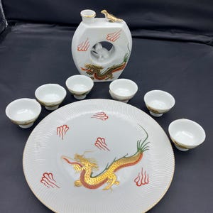 Vintage Kutani Sake Set Japanese Porcelain Hand Painted Moriage Dragonware. Whistling Bird Sake Set Decanter with a cat and 6 cups.