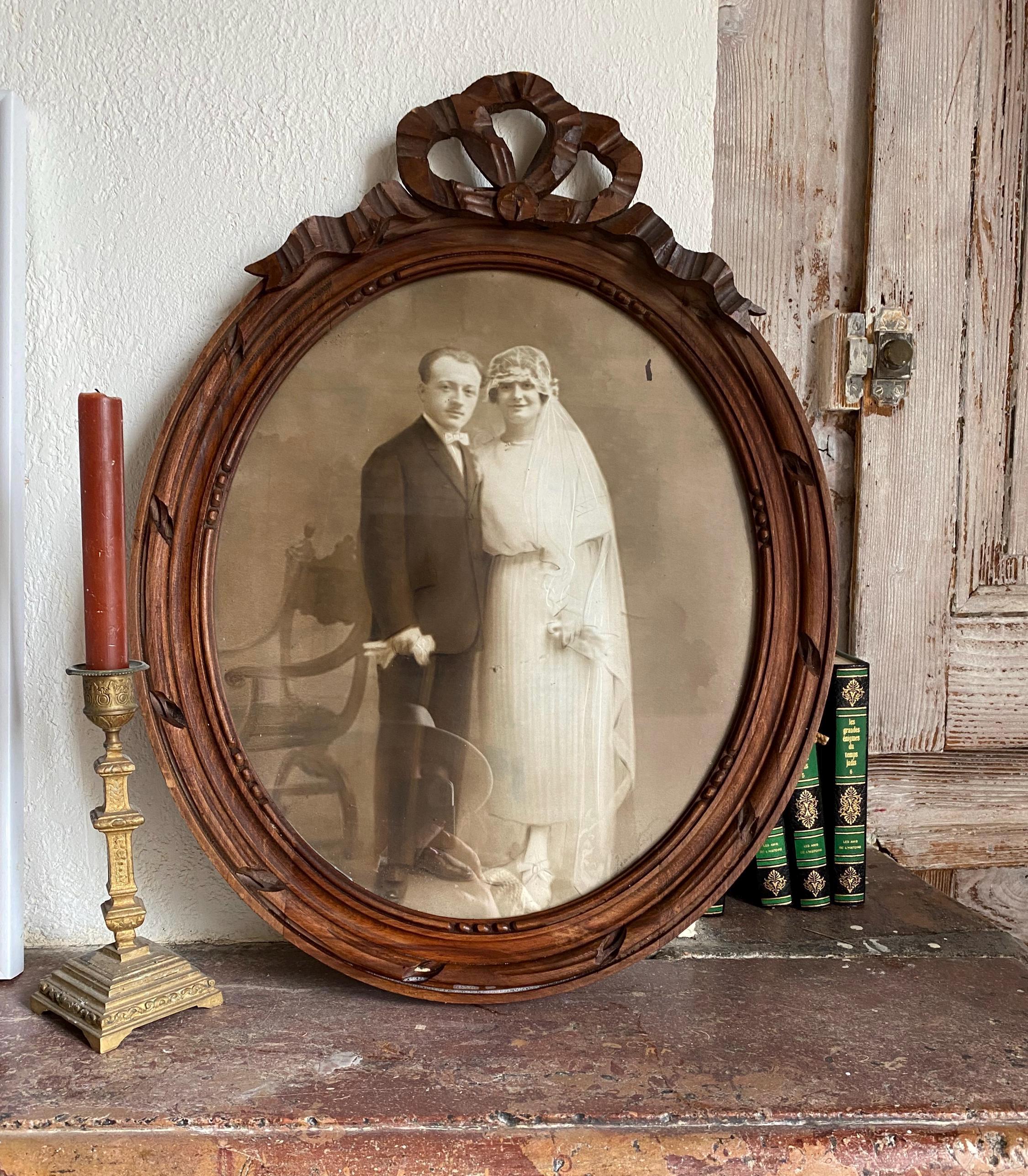 Very large 1900 French photo medallion frame with Louis XVI style bow, oval, French wedding photo frame with bow.