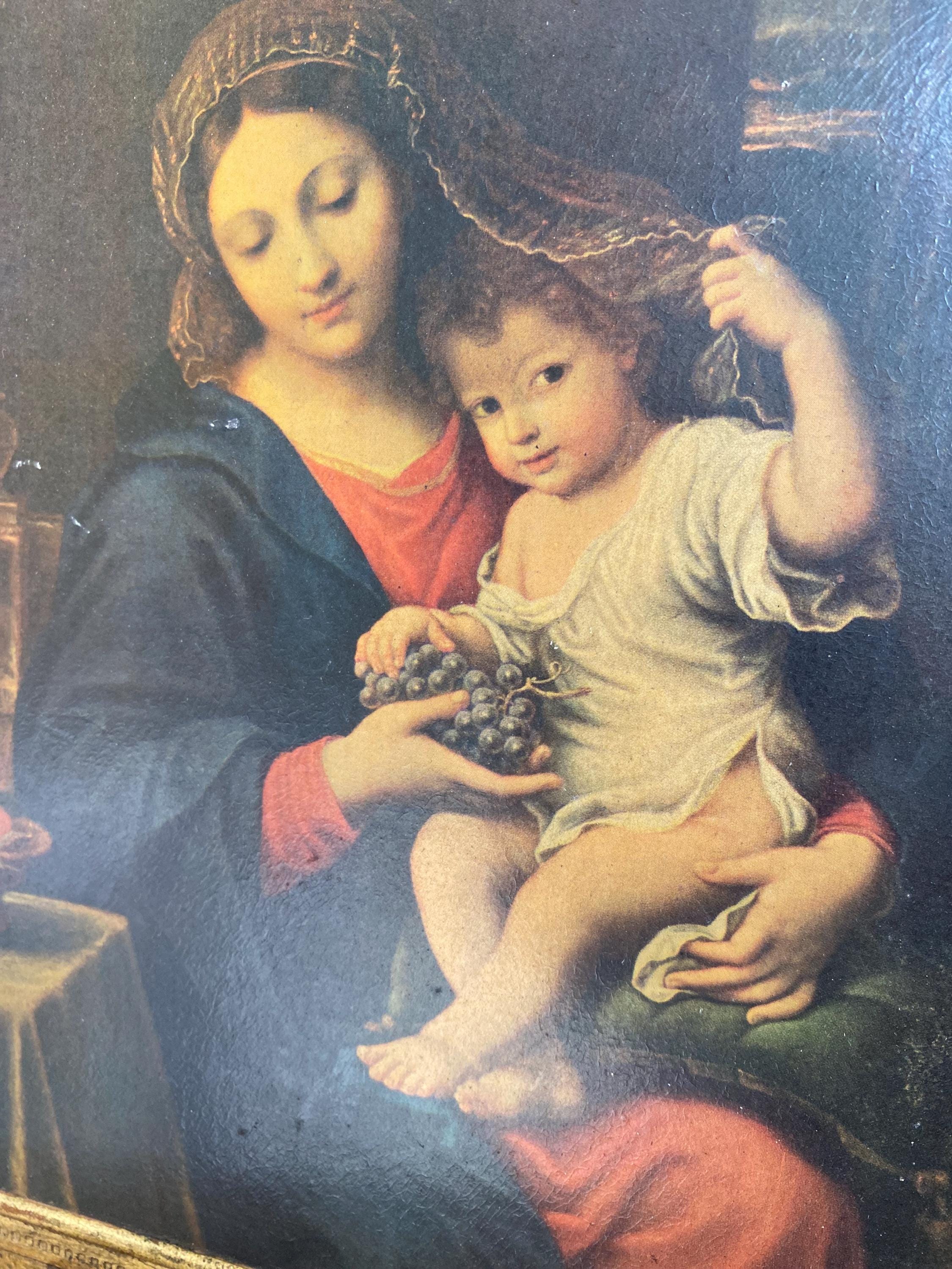 ルーヴル美術館所蔵のピエール・ミニャール作「葡萄の房を持つ聖母」の