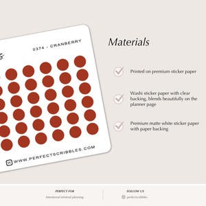 May include: A white sticker sheet featuring rows of small, solid cranberry-colored circular stickers. The sheet includes the text 0374 - CRANBERRY, scribbles, and WWW.PERFECTSCRIBBLES.COM. The right side lists materials with checkmarks for paper types.
