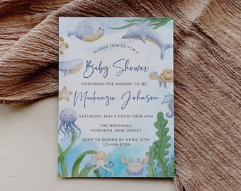 May include: A blue and green baby shower invitation with a watercolor illustration of sea creatures. The invitation reads "Please join us for a Baby Shower honoring the mommy-to-be Mackenzie Johnson. Saturday, May 5 from 12pm-4pm. The Brassrail Hoboken, New Jersey. RSVP to Donna by April 15th: 123-456-6789"
