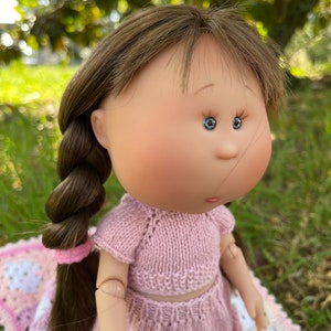 May include: A set of three ceramic mugs with a speckled, matte finish. The mugs are in shades of cream, light gray, and dark gray. Each mug has a simple, minimalist design, perfect for coffee or tea.