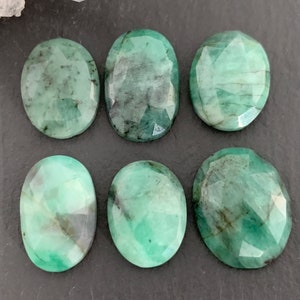 Faceted Emerald oval 15-16mm long cabochon- e