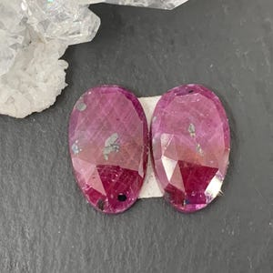 May include: A white ceramic mug with a black handle and the text "But First, Coffee" in a black, bold font. The mug is likely 4 inches tall and holds approximately 12 ounces of liquid.