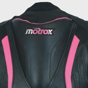 May include: Black leather motorcycle jacket with pink accents and the word "motrox" in white lettering on the back.