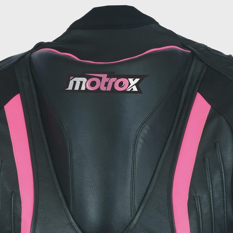 May include: Black leather motorcycle jacket with pink accents and the word "motrox" in white lettering on the back.
