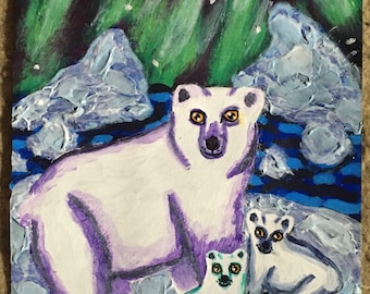 May include: A painting of three polar bears on a snowy landscape under a green and purple aurora borealis. The mother bear is white with purple highlights, and the two cubs are white with green highlights. The painting is signed "Holly-Ann Pinder".