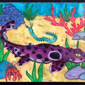 May include: Watercolour painting of an underwater scene with a purple spotted sea creature, red crab, and coral. Green seaweed and a blue sea snail are also present. The artwork is signed by the artist.