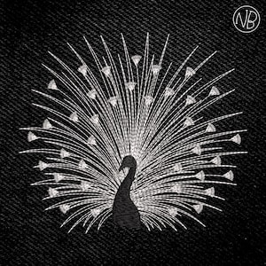 May include: An embroidered peacock design in black and white. The peacock is shown with its tail feathers fully displayed, featuring detailed white embroidery against a black backdrop. The design is centrally placed, possibly on a textured fabric.
