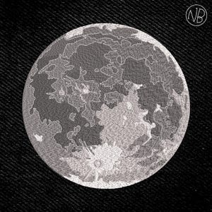 May include: Embroidered patch featuring a detailed depiction of the moon's surface in shades of gray and white. The circular patch is set against a black denim background, with the initials "NB" in a circle in the upper right corner.