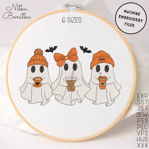 May include: An embroidery hoop featuring three cartoon ghosts, each holding a beverage. The ghosts wear orange hats or bows and are set against a white background. The text "6 SIZES" and "MACHINE EMBROIDERY FILES" are also visible.