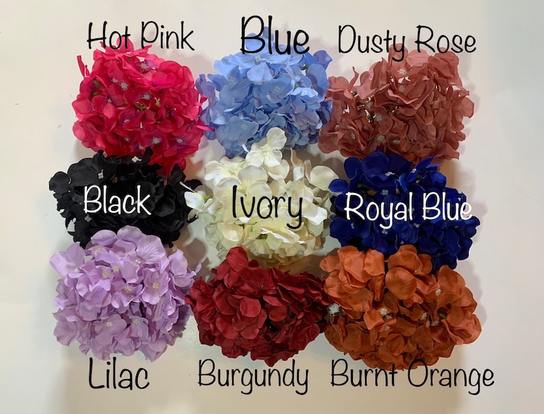 May include: Assortment of 10 faux hydrangea flower heads in various colors, including hot pink, blue, dusty rose, black, ivory, royal blue, lilac, burgundy, and burnt orange.