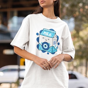 Funny Retro 90s Greek Kawaii Evil Eye Milk Shake Carton T-Shirt | Cute Greek Gift | Unisex Greece Cartoon Shirt | Greek Anime Aesthetic Tee