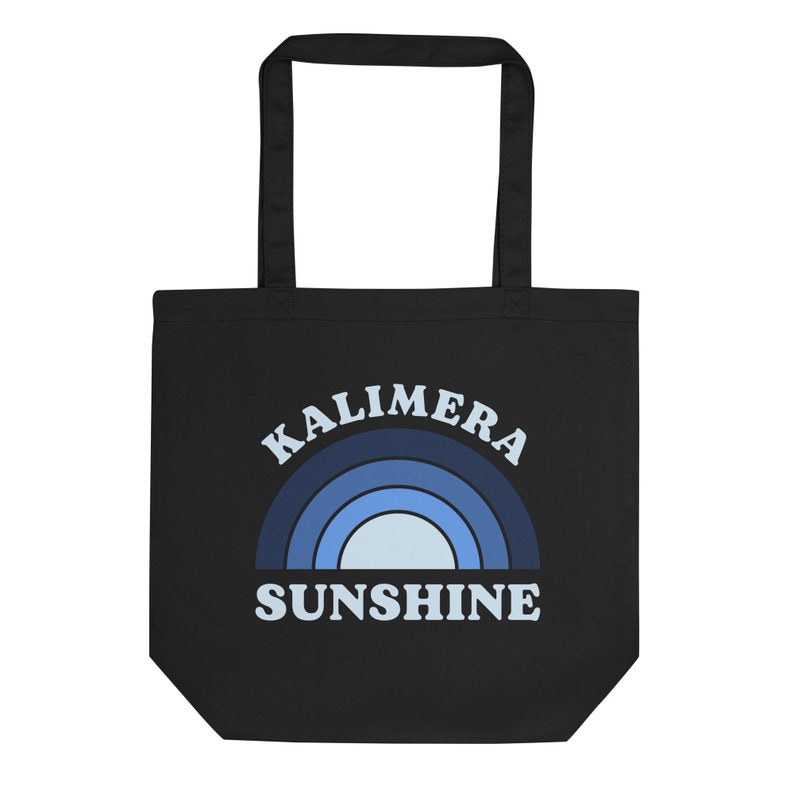 Peut inclure: Sac fourre-tout noir avec un motif arc-en-ciel bleu et blanc et le texte "Kalimera Sunshine".