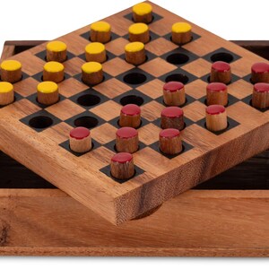 May include: A wooden board game with a checkerboard pattern and a wooden box. The game pieces are small wooden cylinders with yellow and red tops. The game board is made of light brown wood.