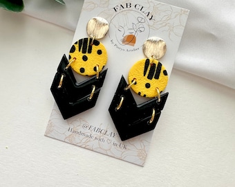 Black and yellow geometrical earrings | modern designed jewelry | handmade polymer clay earrings | lightweight | durable | arrow | fabclay