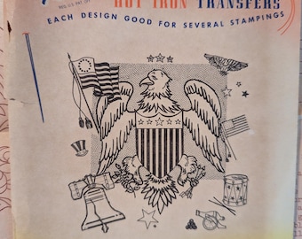 May include: Vintage "Aunt Martha's" hot iron transfer sheet with an eagle design. The sheet includes patriotic imagery such as flags, stars, and a drum. The text reads "3756--Eagle Designs" and "for Embroidery, Textile Painting, Needlepoint Canvas, and Other Art Crafts."