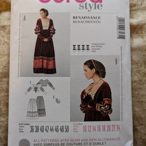 May include: A Burda Style 7171 sewing pattern envelope for a Renaissance-themed dress and headpiece. The white paper packaging displays illustrations of the finished garments, size ranges from 10 to 24, and technical sewing diagrams.