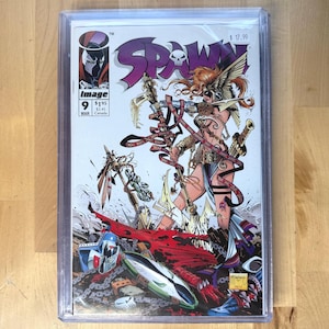 May include: A white ceramic mug with a black handle and the text "But First, Coffee" in a bold, black font. The mug is sitting on a wooden surface. The mug is 4 inches tall.