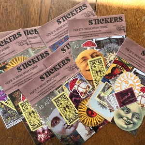 May include: A set of ten vintage witchy stickers featuring a variety of designs, including a sun, moon, mushrooms, and a crystal. The stickers are printed on brown paper with the text "PACK OF 10 VINTAGE WITCHY STICKERS" printed on each sheet.